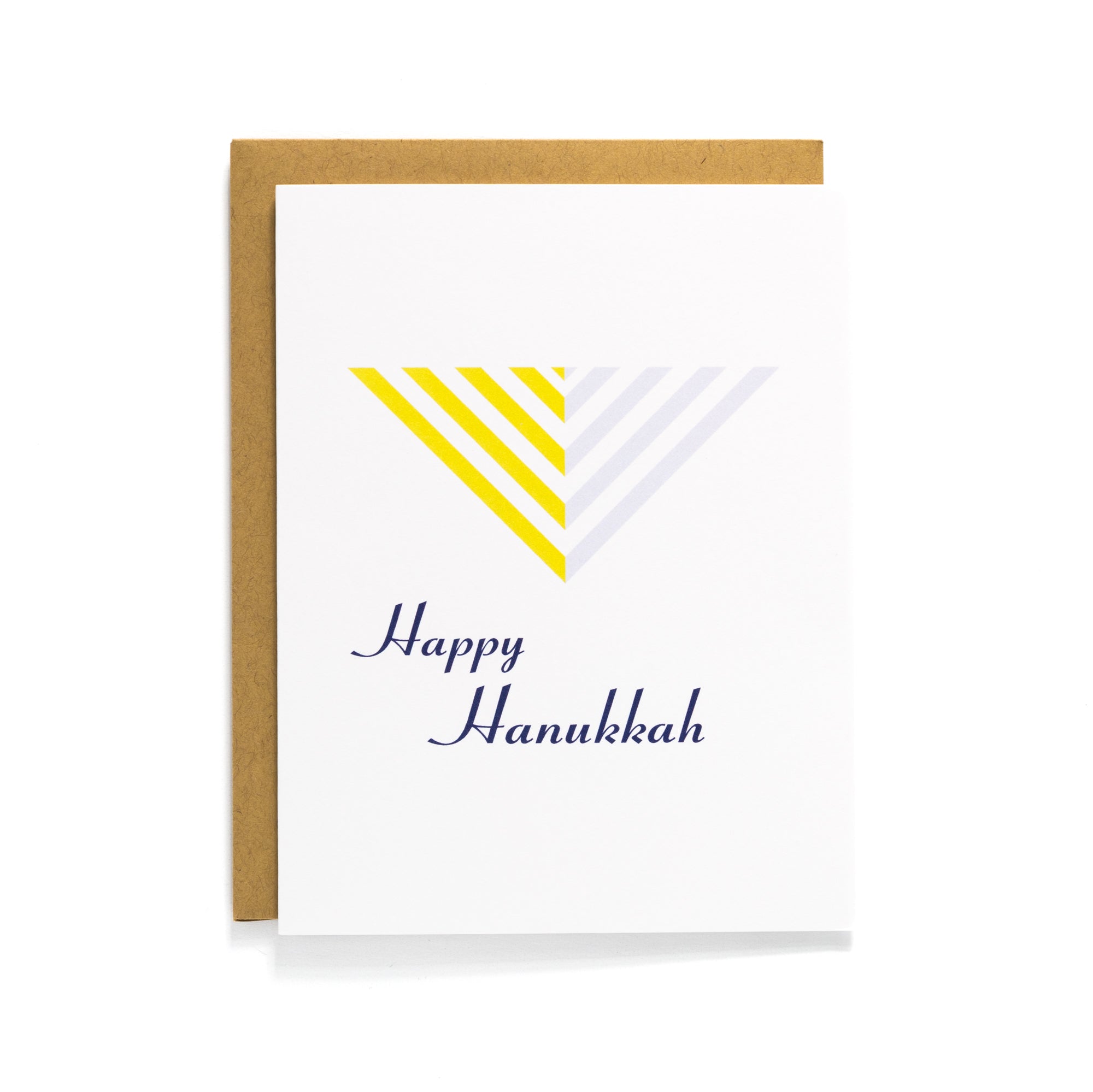 White Hanukkah card with modern yellow and gray menorah design and Happy Hanukkah text, paired with a Kraft envelope