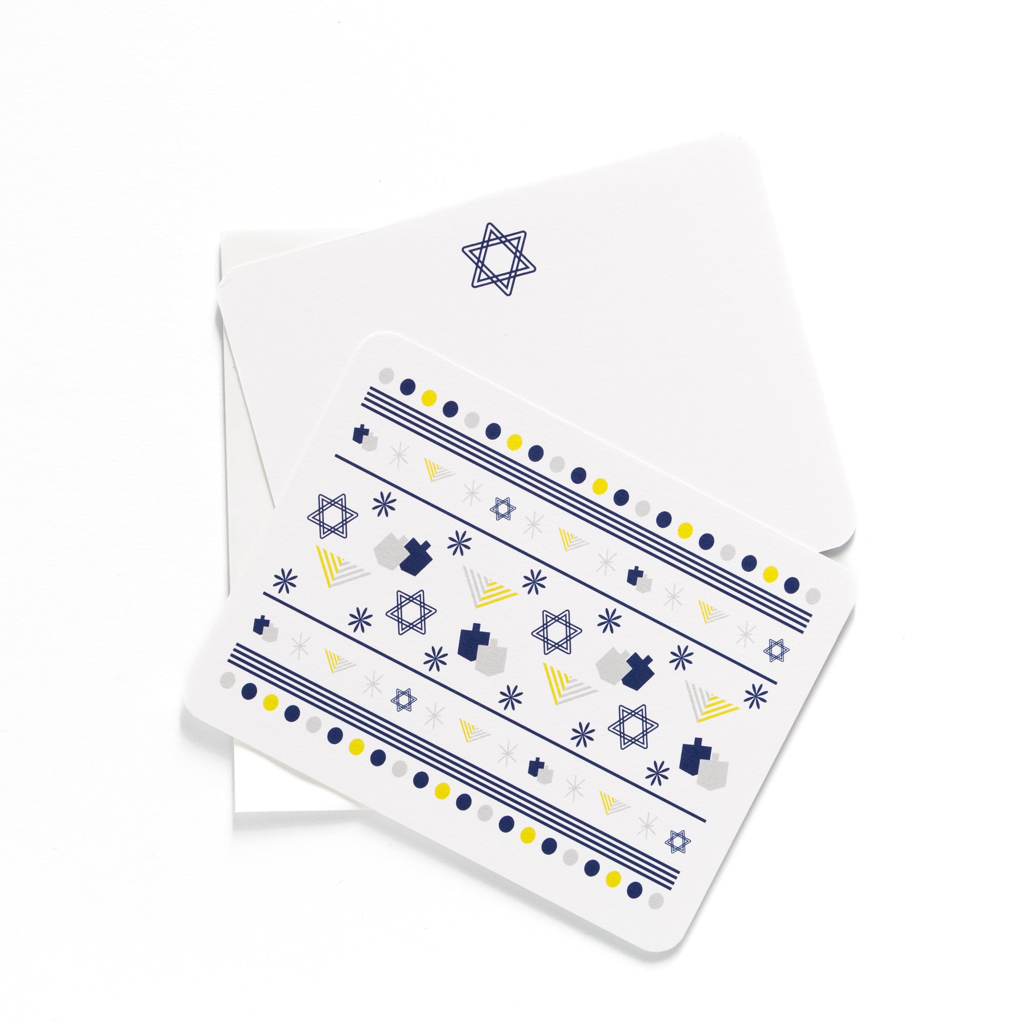 Hanukkah flat card set with dreidels, Stars of David, and matching envelopes in blue and yellow colors