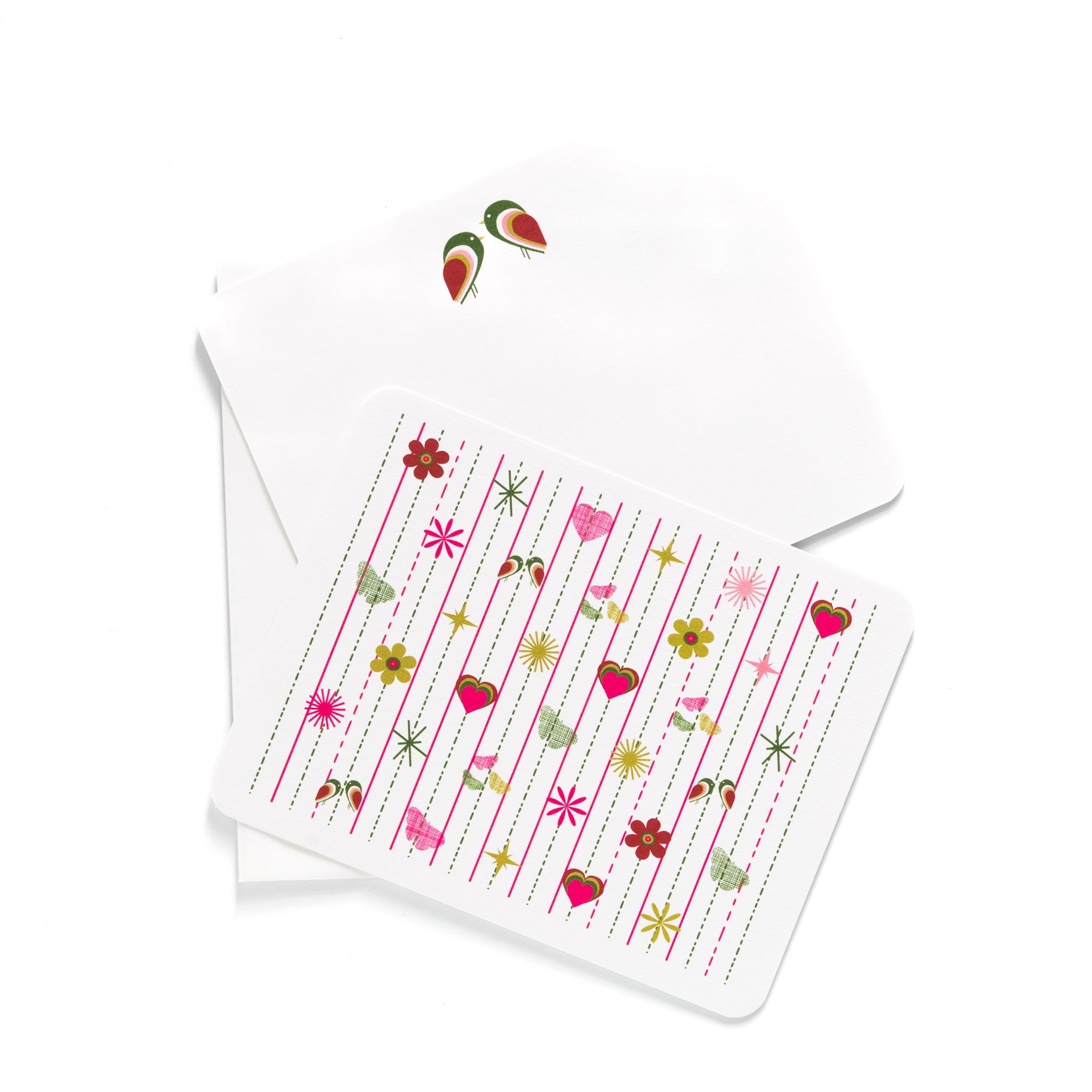 Pink Tiki flat card with colorful retro flowers, hearts, and stars, paired with a white envelope featuring a small floral design.
