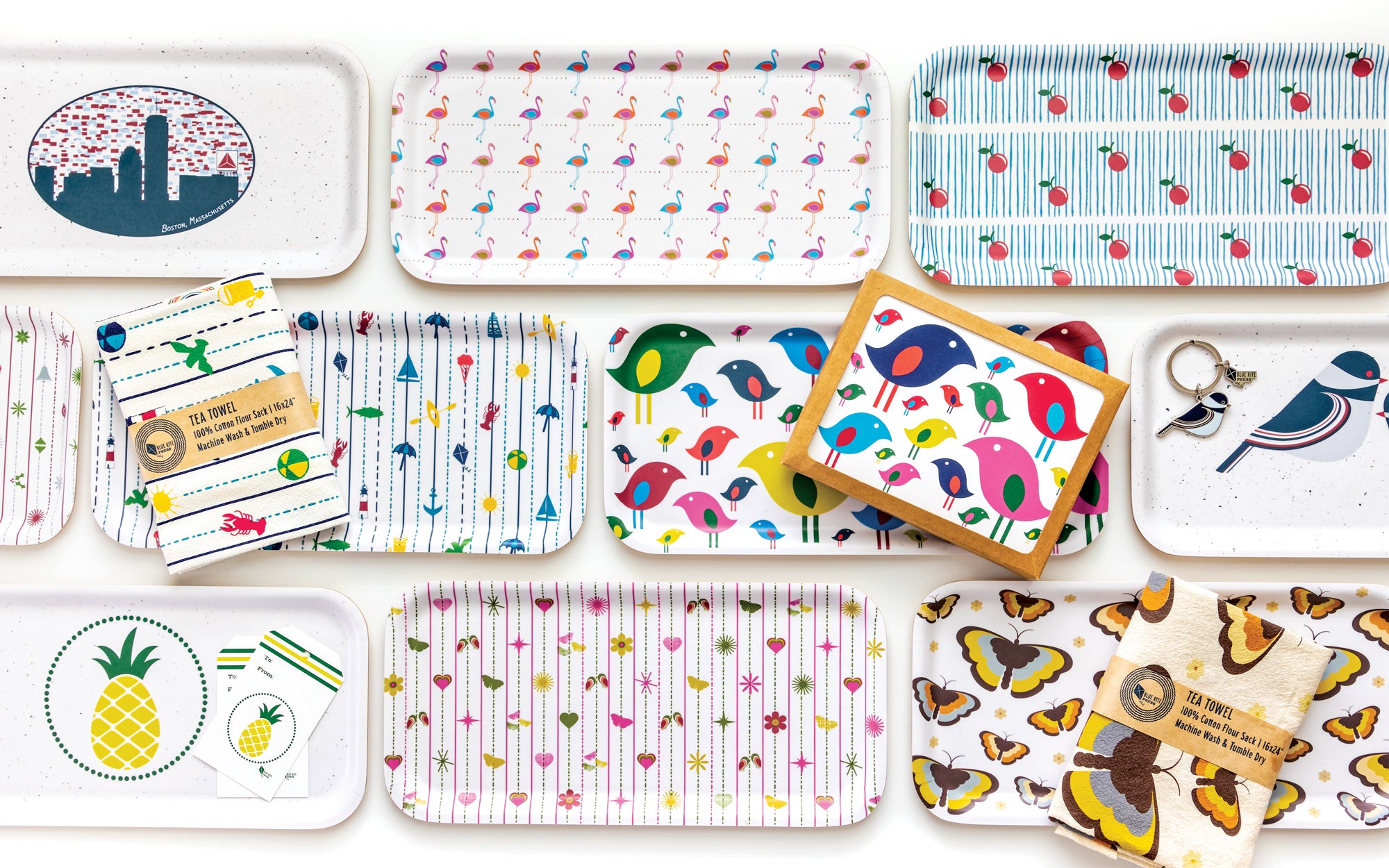 Tea towels, notecards and birch trays with colorful illustrations