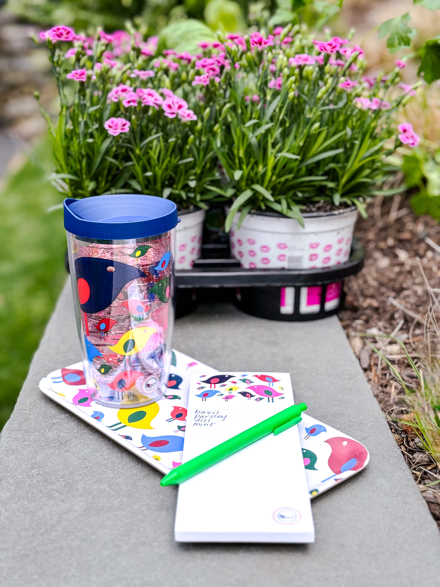 Tervis tumbler, notepad and tray decorated with colorful birds in garden