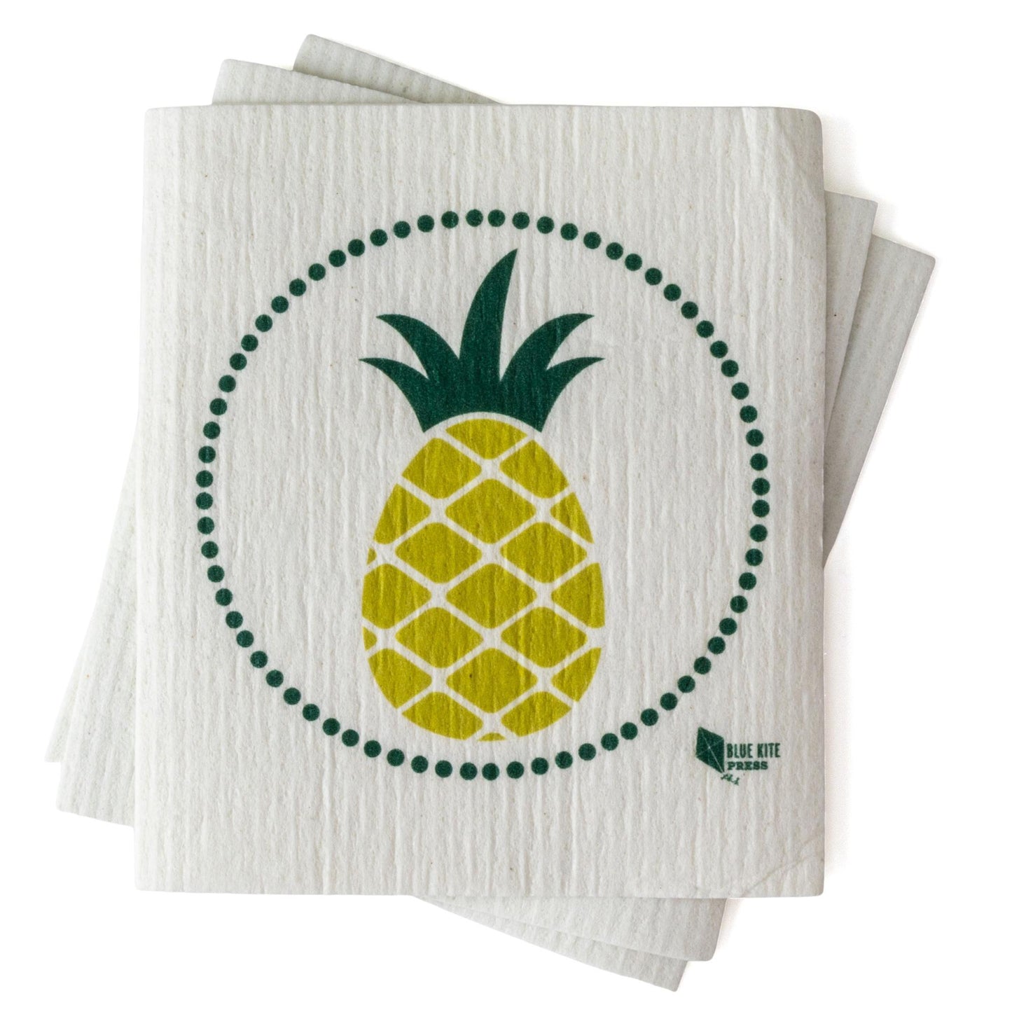 Eco-friendly Swedish dishcloth with modern yellow pineapple design, surrounded by green dotted circle, on white textured background. Sustainable alternative to paper towels.