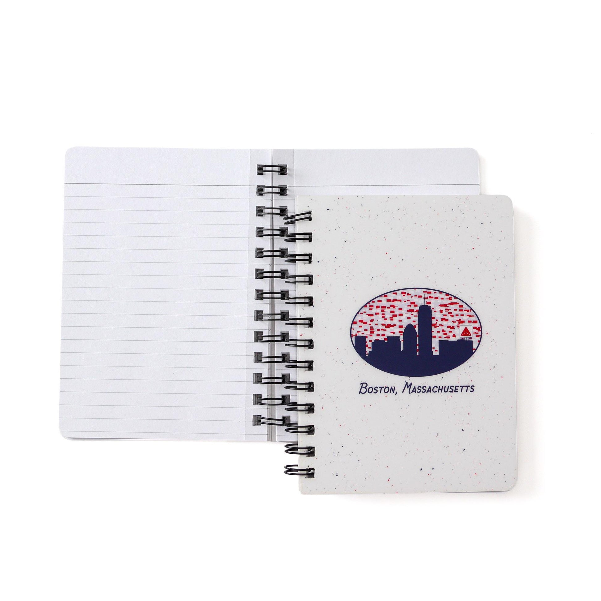 Spiral-bound notebook featuring Boston skyline with iconic Citgo sign in oval design on speckled cover. Open to display lined pages and black wire binding.