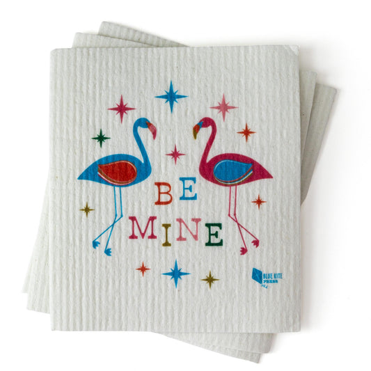 Be Mine Flamingo Swedish Dishcloth with colorful design featuring two flamingos, stars, and text on white textured background, eco-friendly kitchen cleaning product