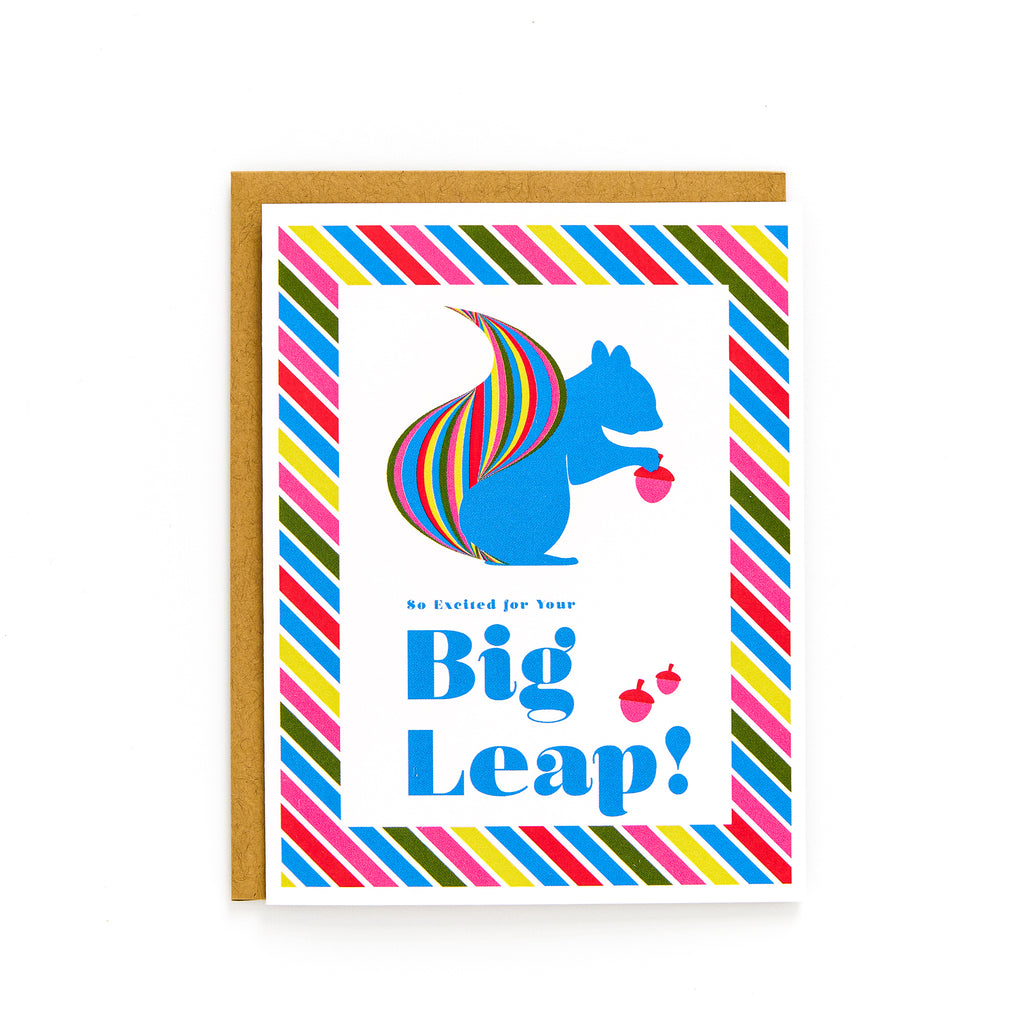 Card with a blue squirrel with rainbow-striped tail and acorns reading "Big Leap" in colorful striped border