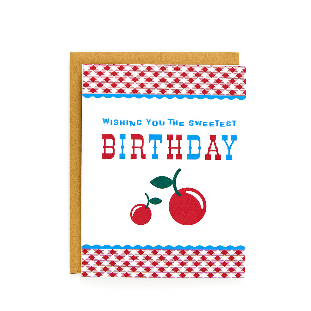 Cherry Sweetest Birthday Card with red cherries and red gingham border on white background, blank inside with kraft envelope.