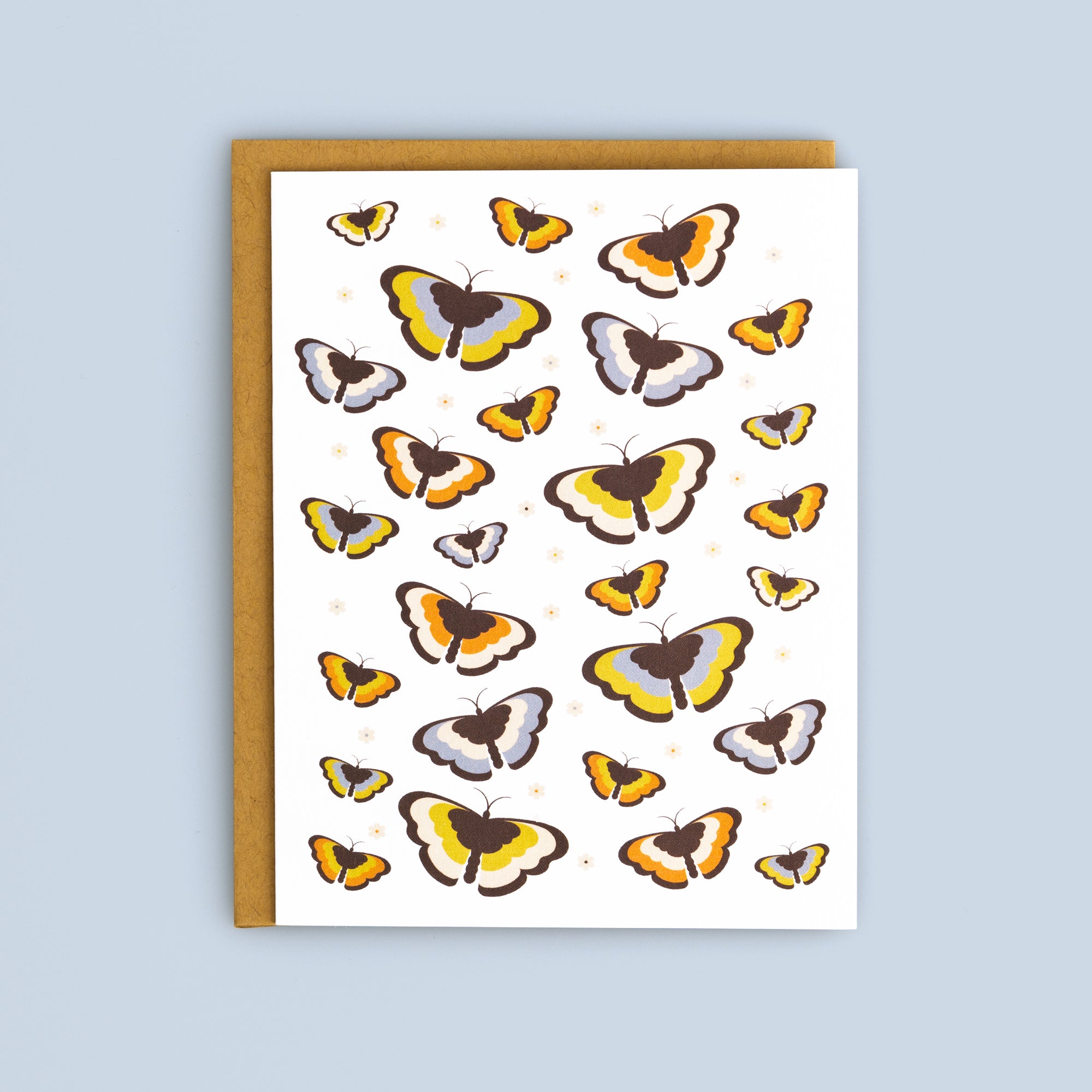 Flat card featuring colorful butterflies in yellow, orange, brown, and gray tones with a kraft envelope on a light blue background.