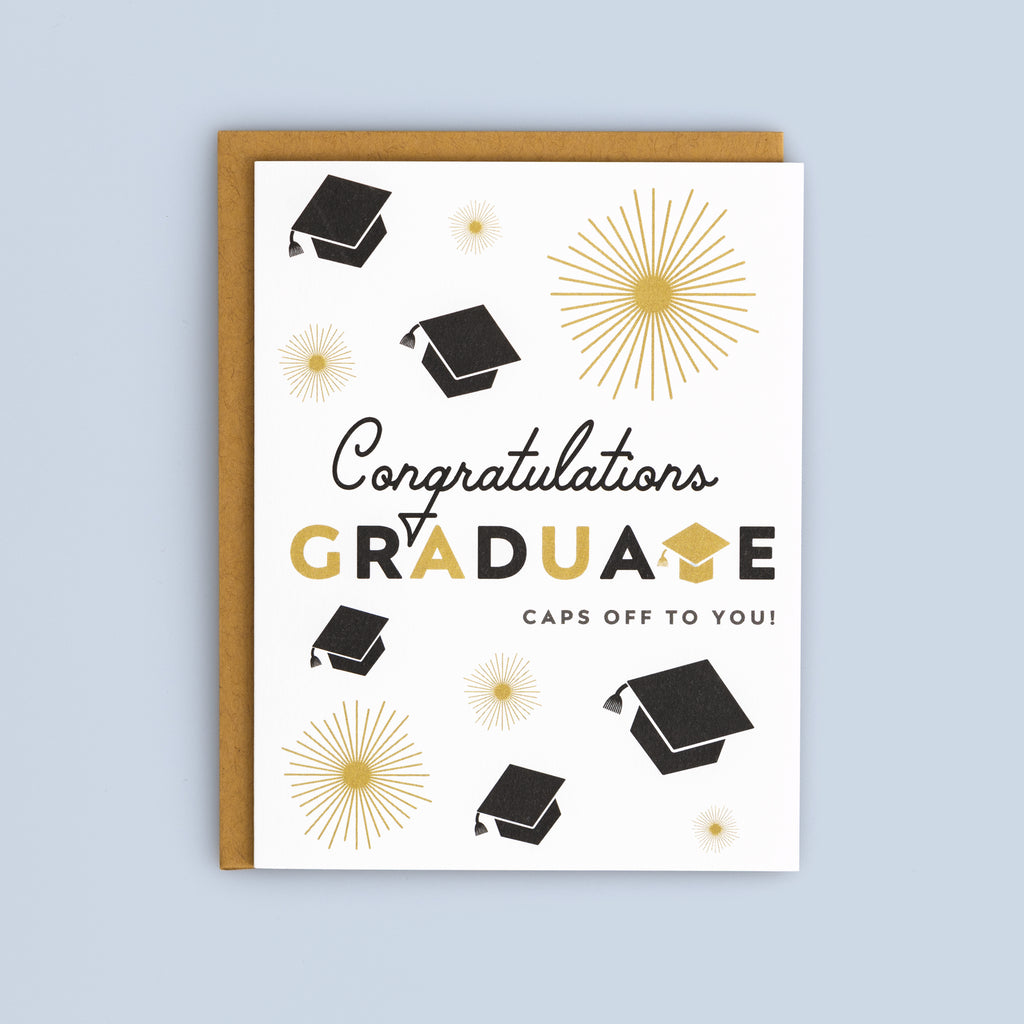 Flat graduation card with black caps and gold starburst accents, featuring "Congratulations Graduate" text on white background