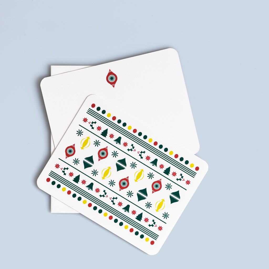 Set of six Christmas flat cards featuring colorful retro ornament and star patterns with matching white envelopes.