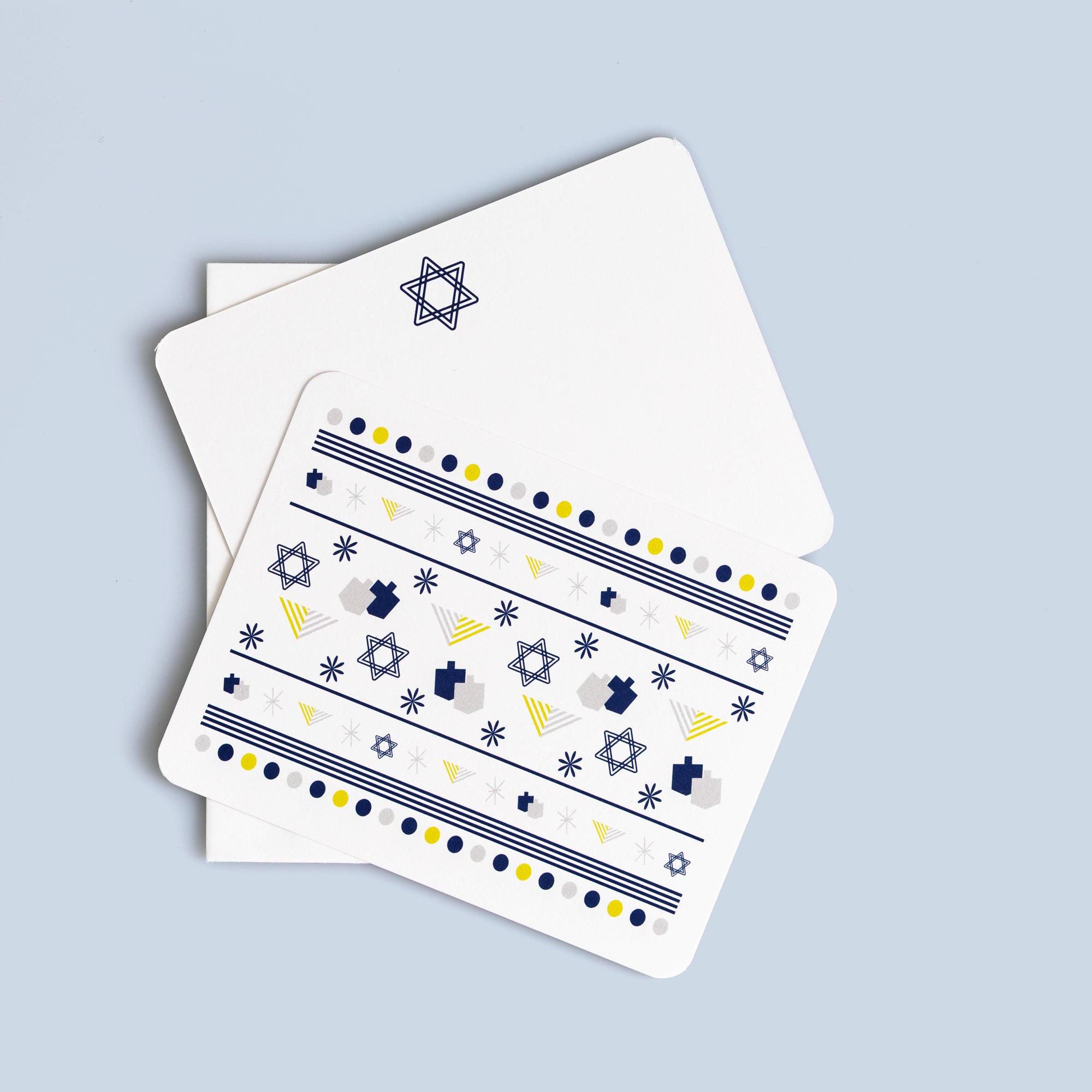 Hanukkah flat card set featuring menorahs, Stars of David, and dreidels with coordinating envelopes, six cards included