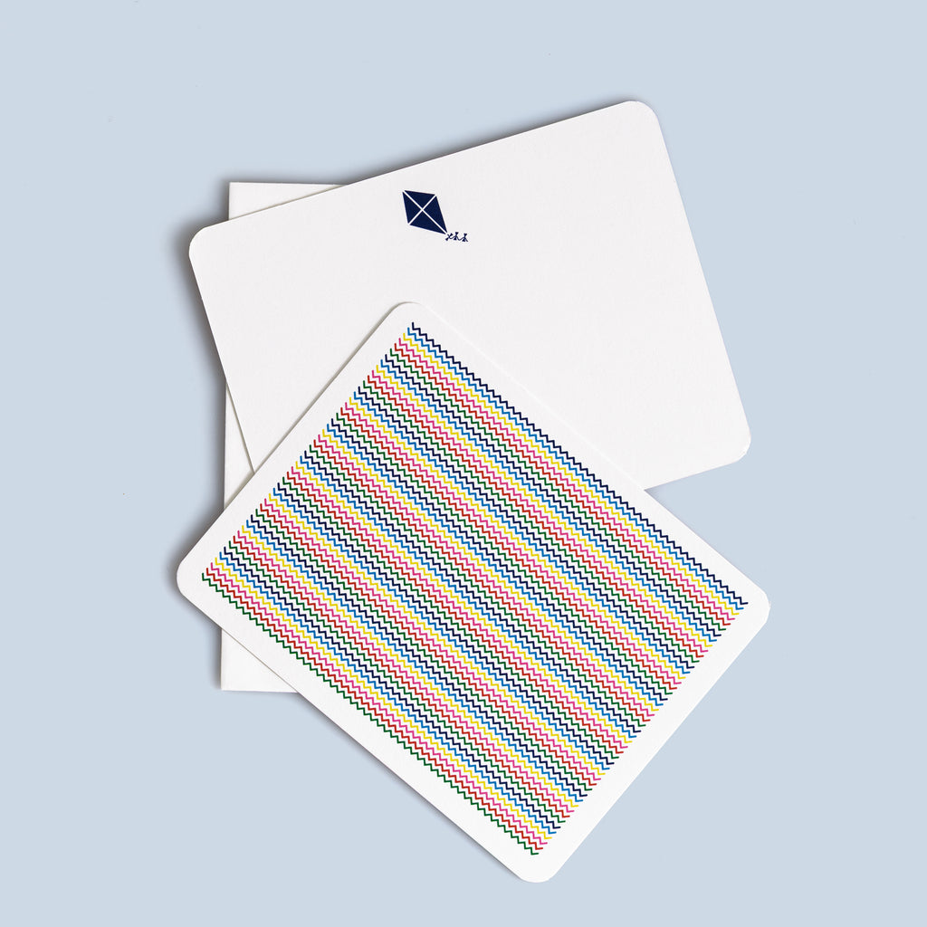 Set of six flat cards featuring colorful zigzag patterns and small kite illustrations, with coordinating envelopes.