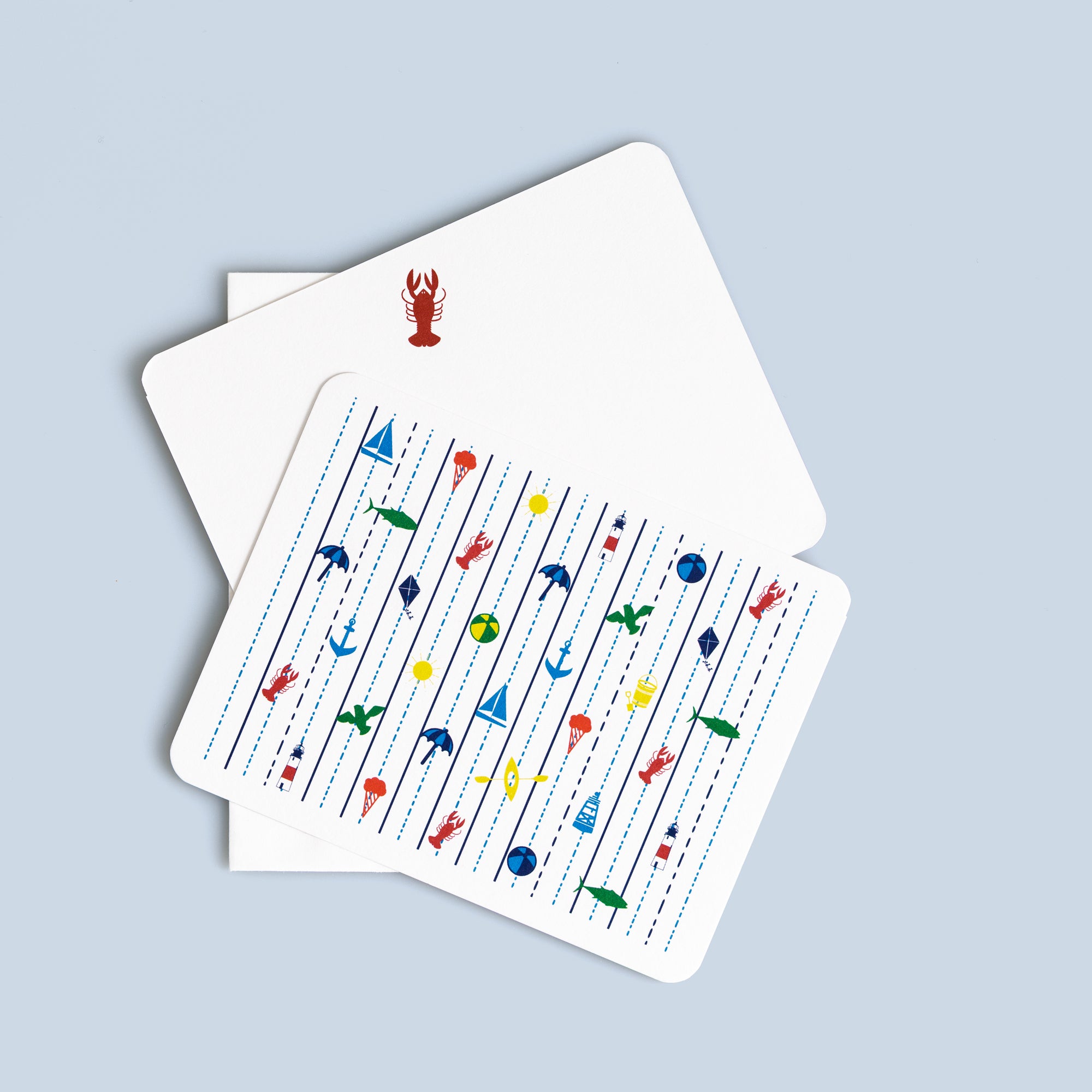 Set of six seaside flat cards with nautical icons, including lobsters, anchors, and sailboats, with coordinating envelopes.