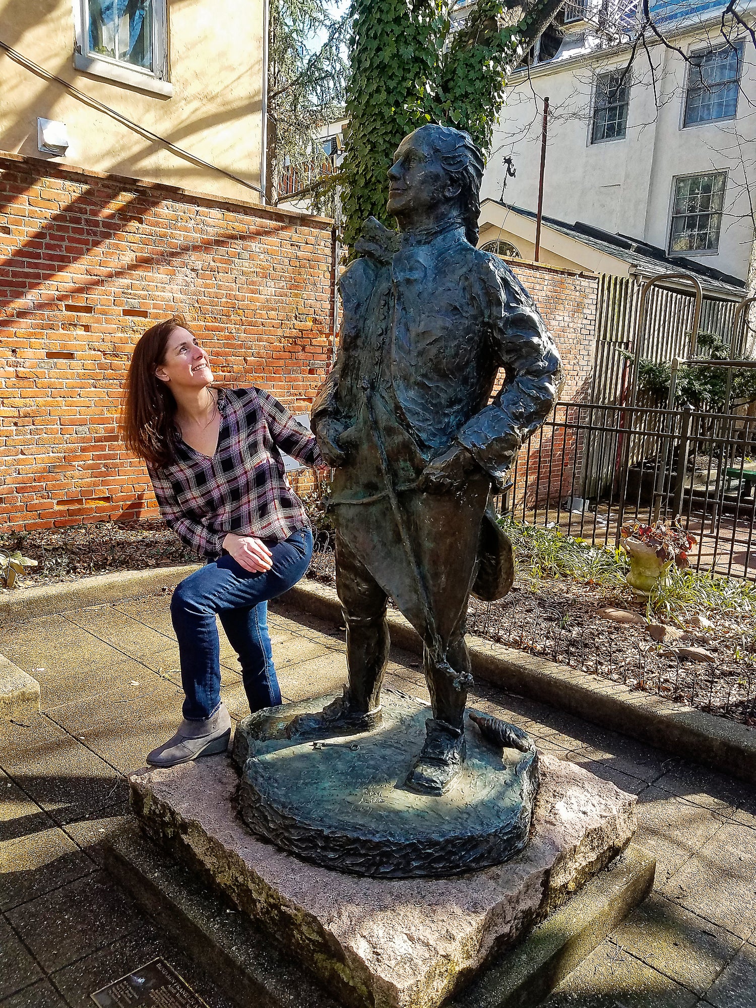 Dana Lynch, owner of Blue Kite Press with Ben Franklin and kite statue in Philadelphia, PA