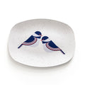 Oval serving tray with modern blue and red chickadee bird design on a white speckled background