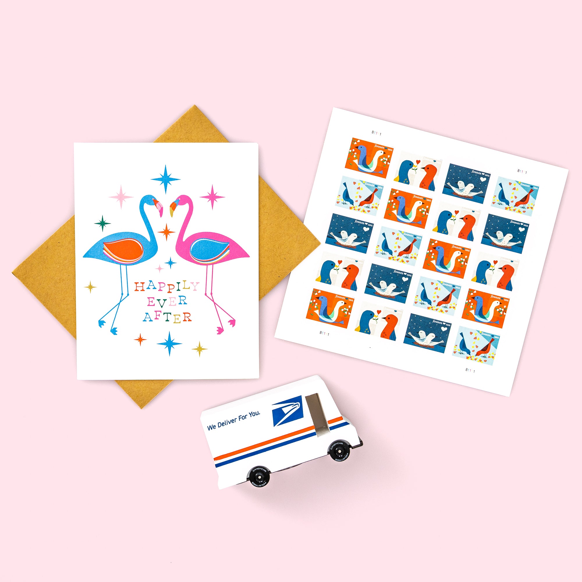 Two romantic birds on a greeting card that says "Happily Ever After" and the USPS Love Stamp 2026 and truck