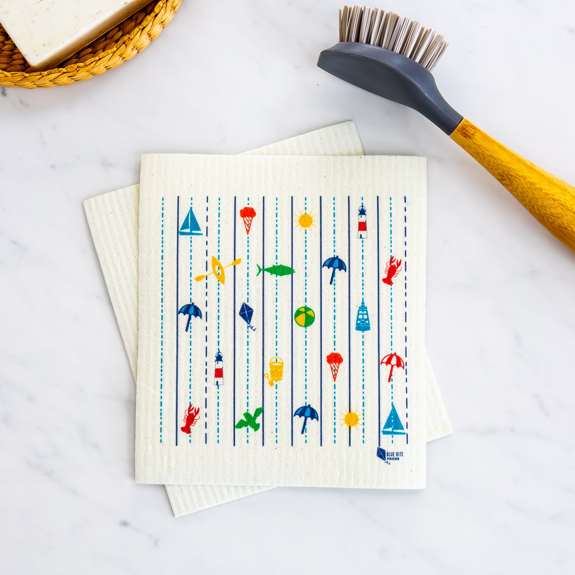 Seaside Swedish Dishcloth with New England coastal design of lobsters, sailboats, and lighthouses, eco-friendly reusable cloth.