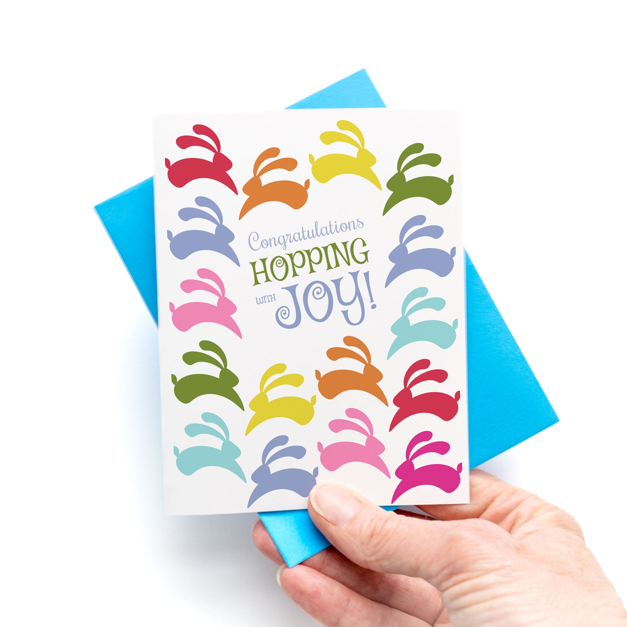Bunny Bright Congratulations Card with colorful hopping bunnies and joyful message on front with blue envelope.