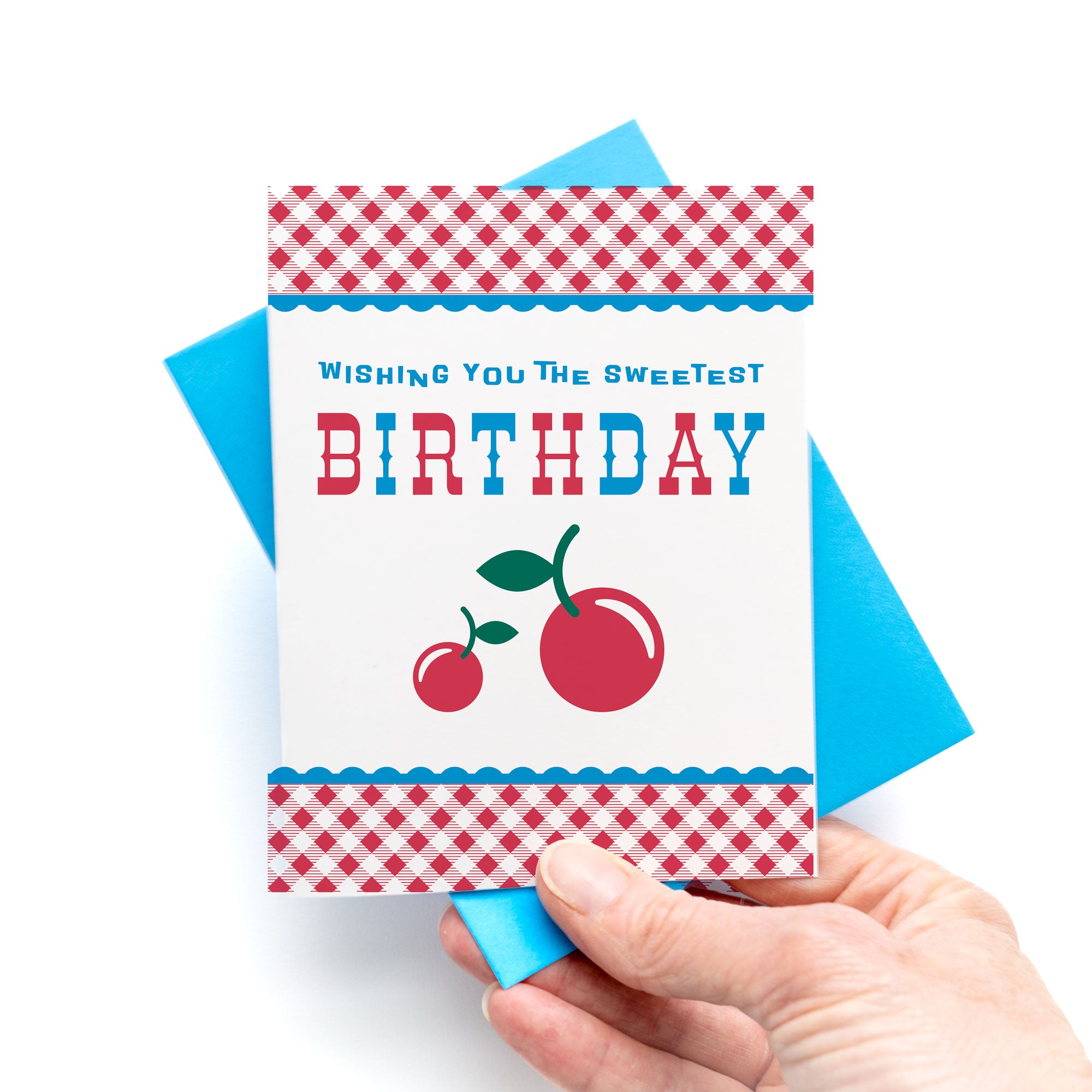 Cherry Birthday Card Sweetest Birthday featuring red cherries and gingham pattern with a blue envelope.