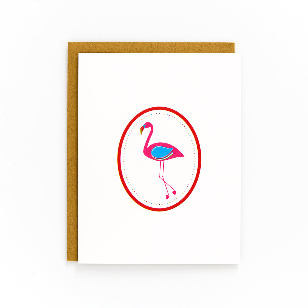 A retro-style Flamingo Card with a pink flamingo illustration on a white background, including a brown Kraft envelope.