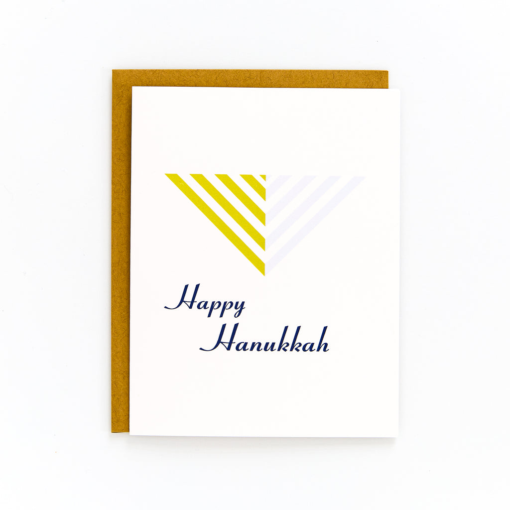 Hanukkah card with modern menorah design and "Happy Hanukkah" text, includes kraft envelope, blank inside.