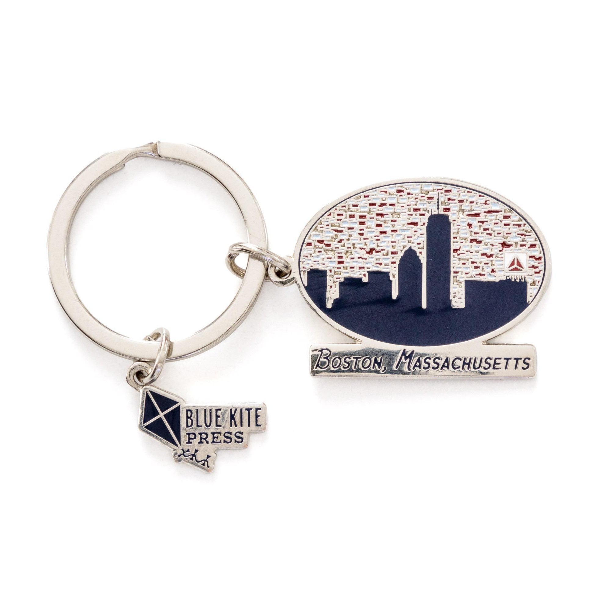 Silver keychain featuring Boston skyline silhouette with iconic Citgo sign, red-dotted sky background, and &#39;Boston, Massachusetts&#39; text. Includes Blue Kite Press logo charm. Stylish souvenir accessory for keys or bags.