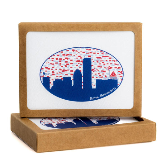 Boston skyline notecard set with iconic Citgo sign silhouette in blue, framed in oval shape with red and white pattern background, packaged in brown kraft box