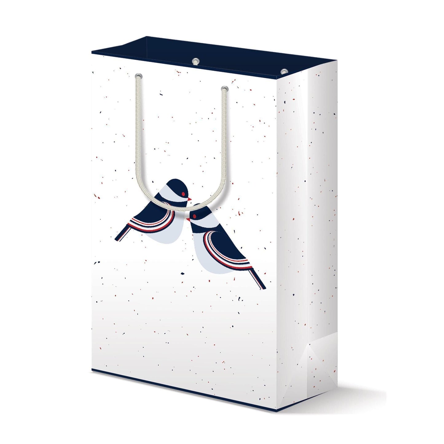 White matte paper gift bag with navy blue top, featuring stylized chickadee birds in navy, red, and white. Modern design with speckled background and minimalist bird illustrations perched on handle cutouts.