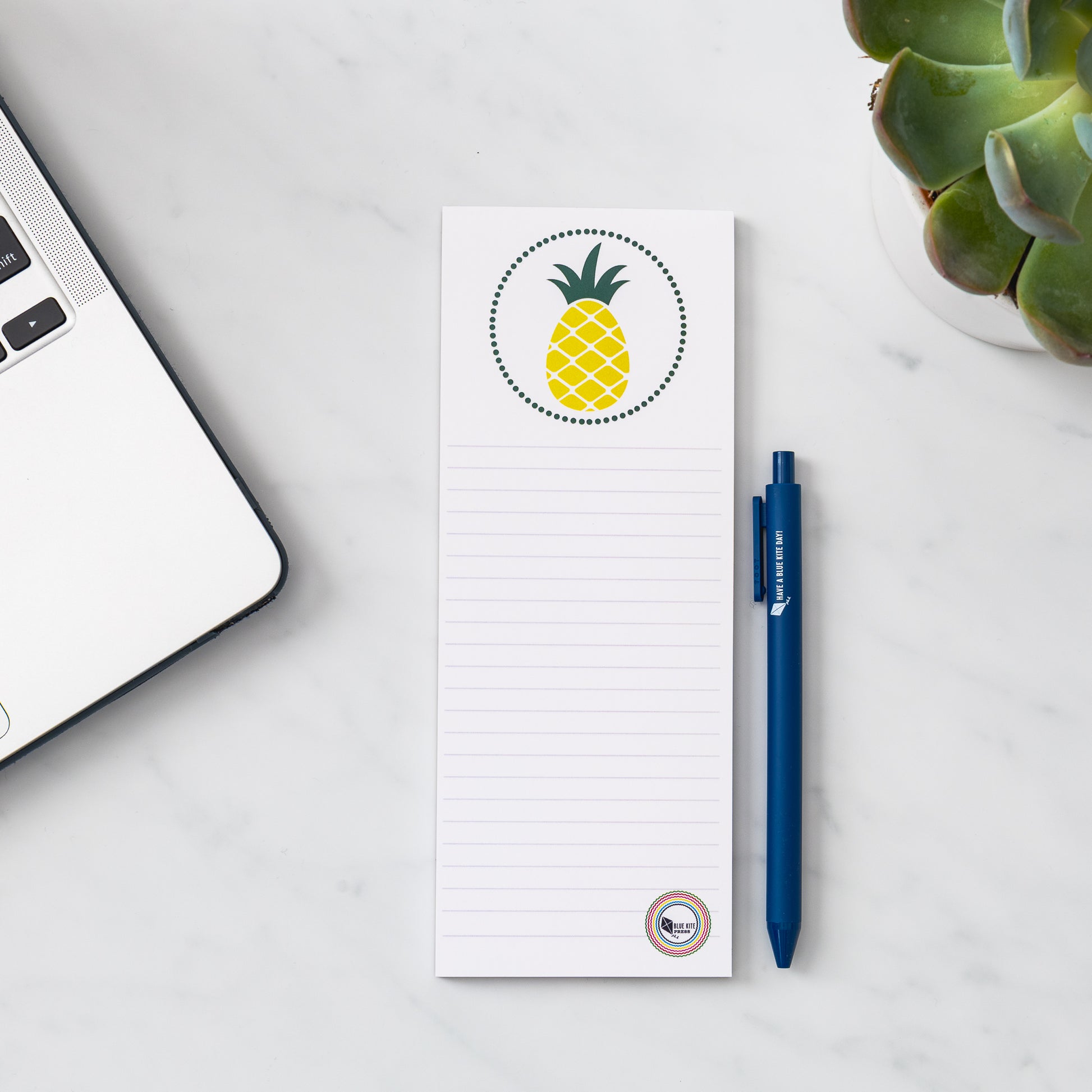 Pineapple lined 3x8 notepad with laptop and plant for to do lists