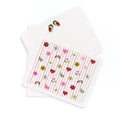 Pink Tiki flat card with colorful mid-century modern floral and heart pattern, accompanied by a matching envelope.