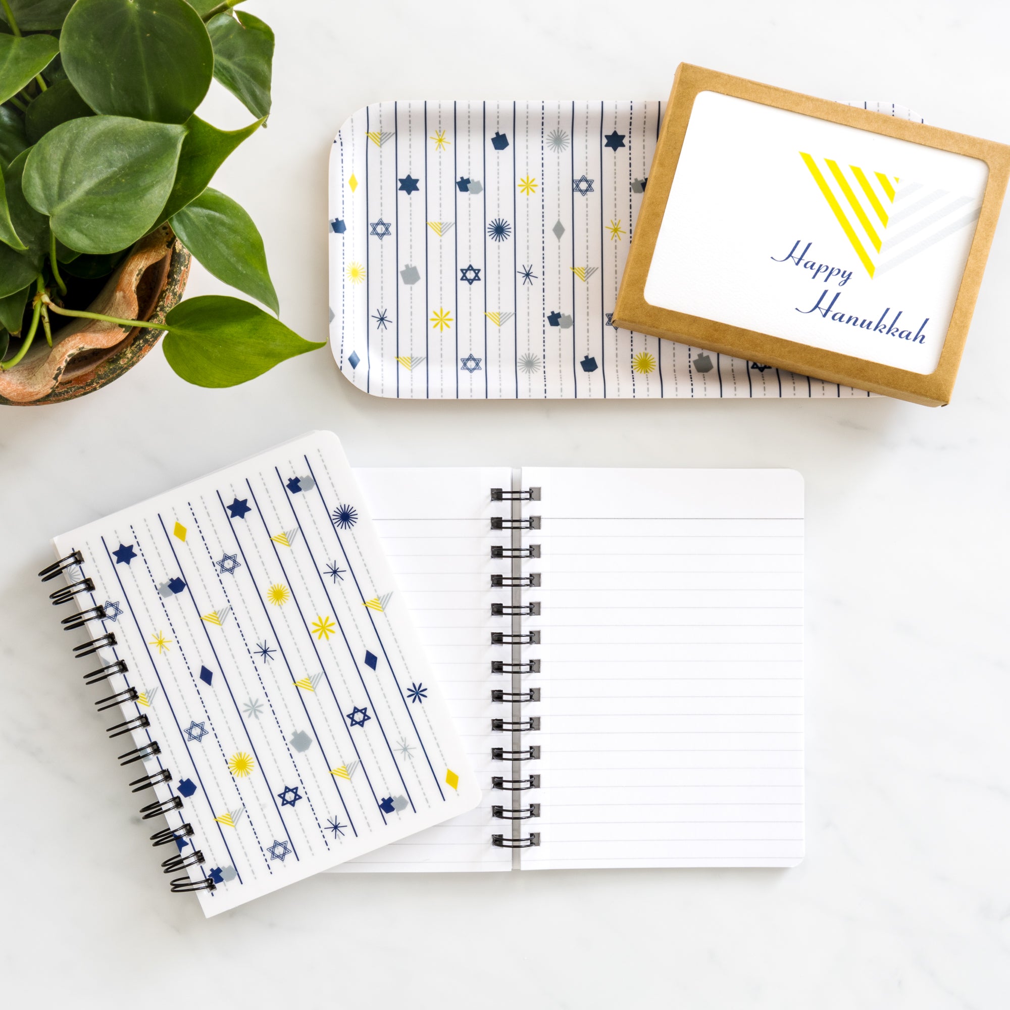 Hanukkah Notebook | Dreidels & Menorahs | 5x7 Spiral with festive holiday symbols on cover and lined pages inside.