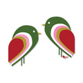 Two layered green, pink, red, and yellow stylized tiki bird stickers facing each other on white background